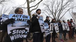 Climate activists gather to protest with demanding President Biden stop the Willow Project by unfurling a banner on the Lafayette Square in front of the White House on January 10, 2023 in Washington D.C.