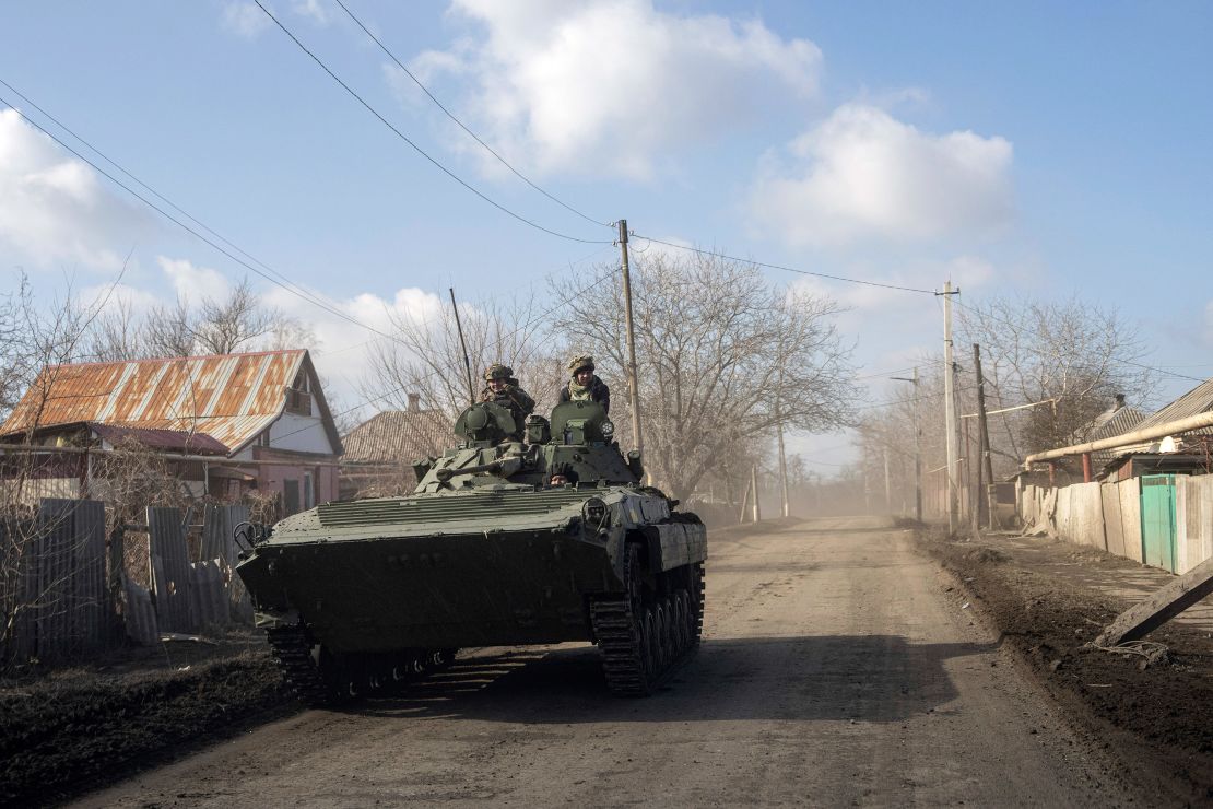 A Ukrainian APC drives towards frontline positions near Bakhmut on Saturday, March 4.