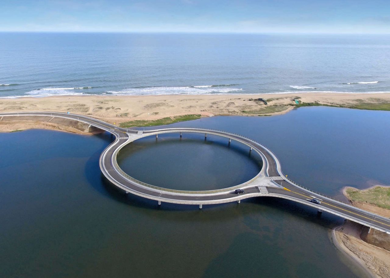 The Laguna Garzón Bridge's unique circular shape, slows traffic to allow travelers to enjoy the scenic view.