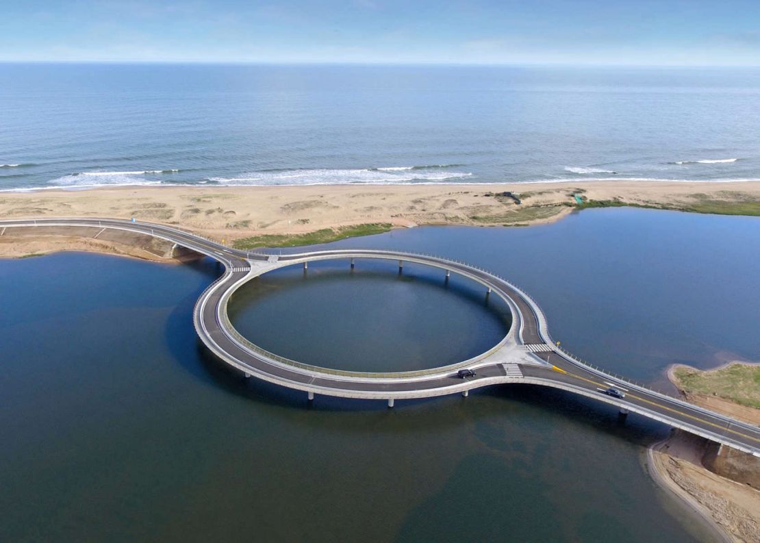 The Laguna Garzón Bridge's unique circular shape, slows traffic to allow travelers to enjoy the scenic view.