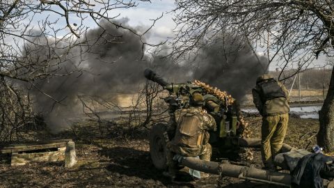 Ukrainian soldiers fire a 105mm howitzer at Russian positions near the city of Bakhmut on March 4, 2023.
