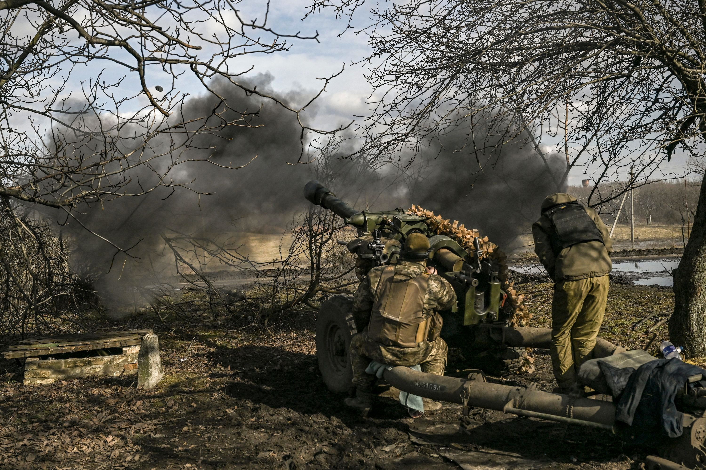 Ukrainian soldiers burn Russian flag as they reclaim territory