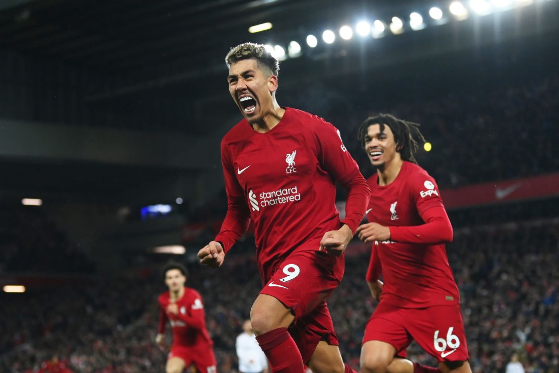 Roberto Firmino celebrates after scoring Liverpool's seventh goal.