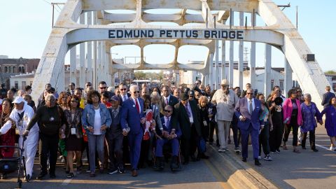 Biden and others walk across the Edmund Pettus Bridge in Selma on March 5, 2023.