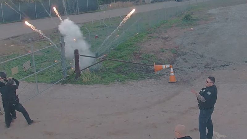 NextImg:Video: See crowds of protesters swarm and attack future police facility | CNN