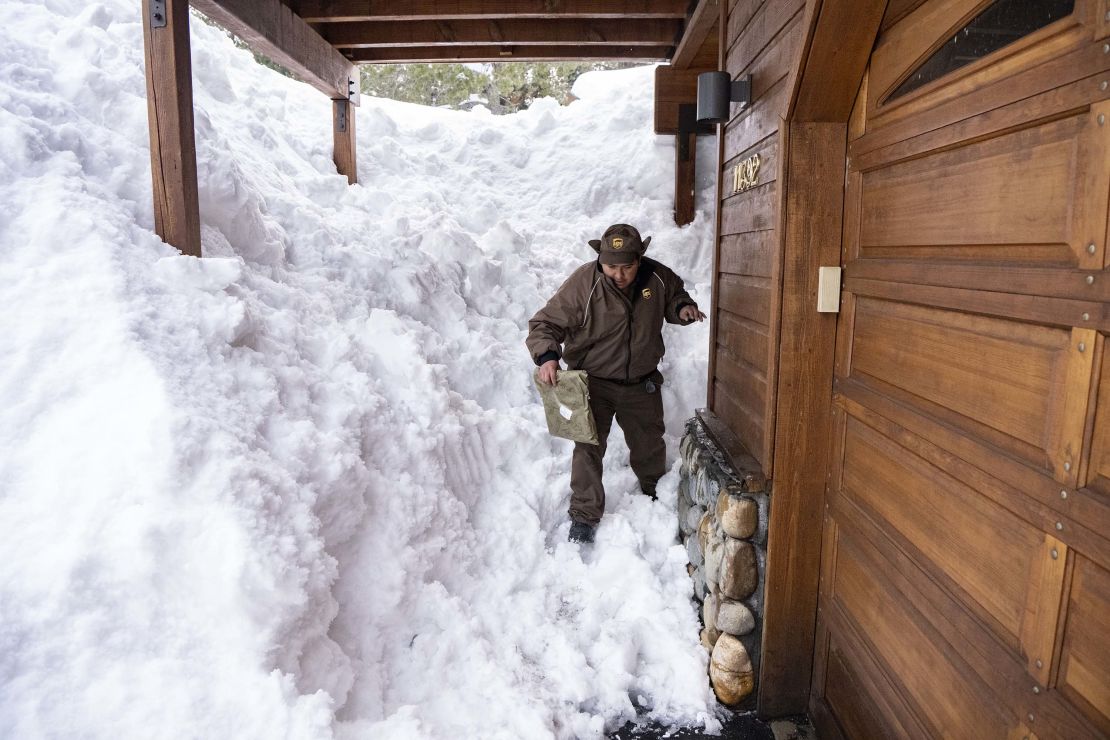 UPS delivery driver Juan Hernandez delivers a package to a snow-covered home in Truckee, California, Friday.
