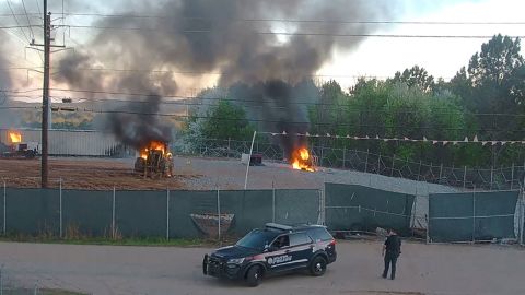 Fires smolder Sunday at the planned police training site in Atlanta.