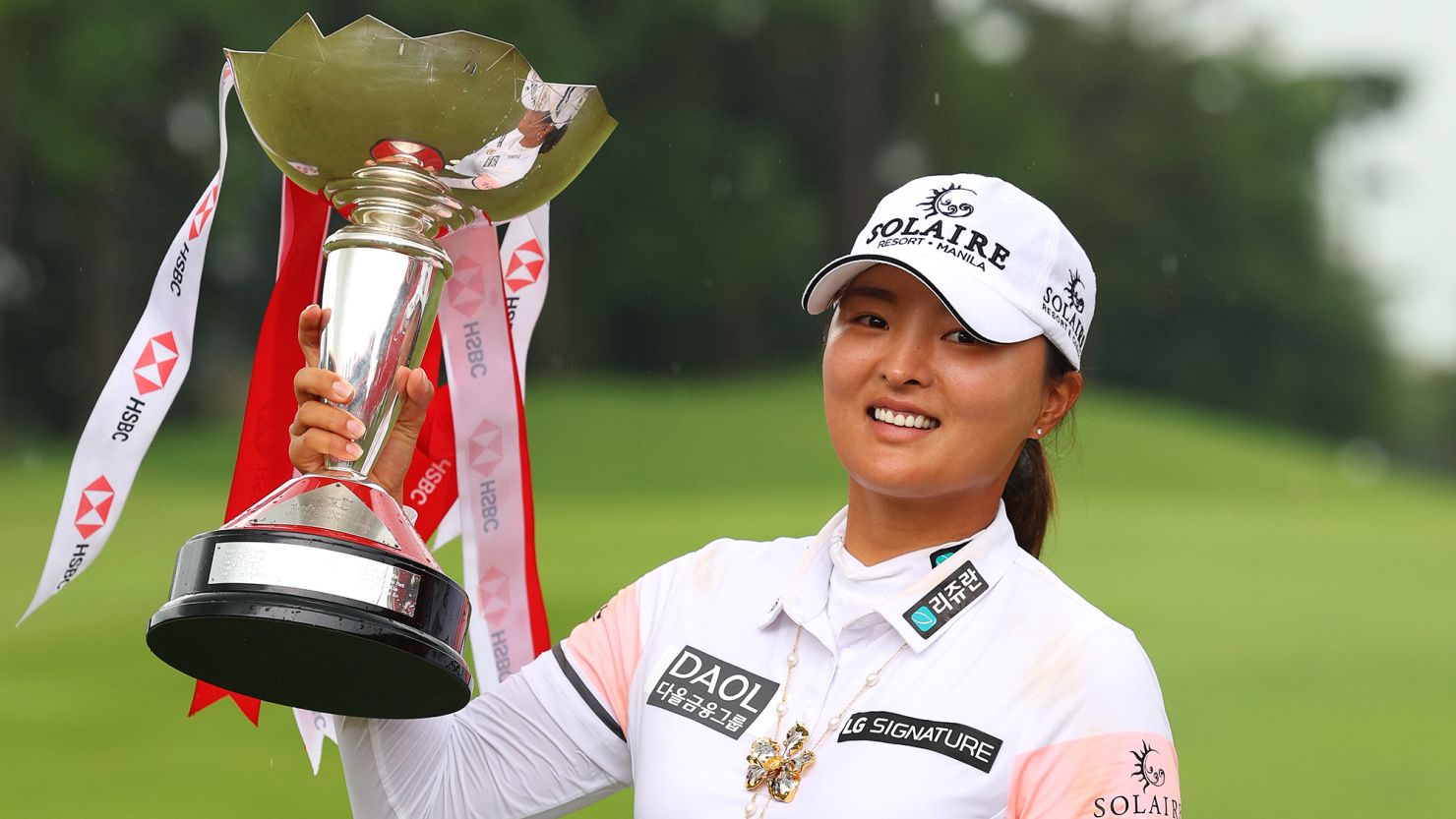 Ko Jin-Young poses with the HSBC Women's World Championship trophy after victory at Sentosa Golf Club.