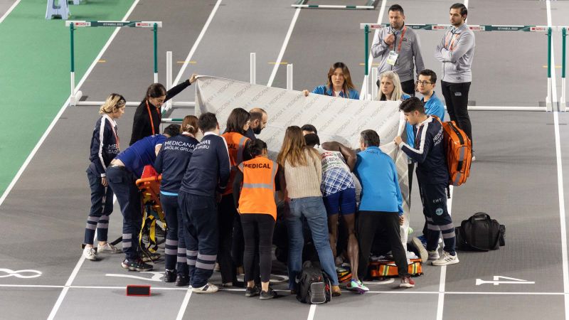 NextImg:Spanish hurdler Enrique Llopis stretchered off after horror fall at European Indoor Championships | CNN