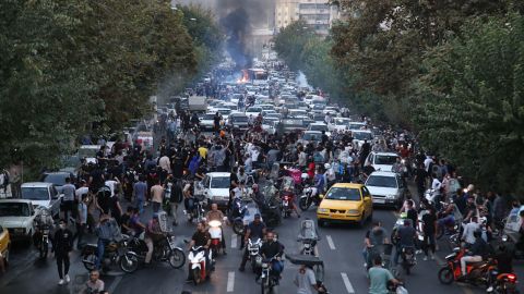 Iranian protesters take to the streets of Tehran during a protest in front of Mahsa Amini on September 21, 2022.