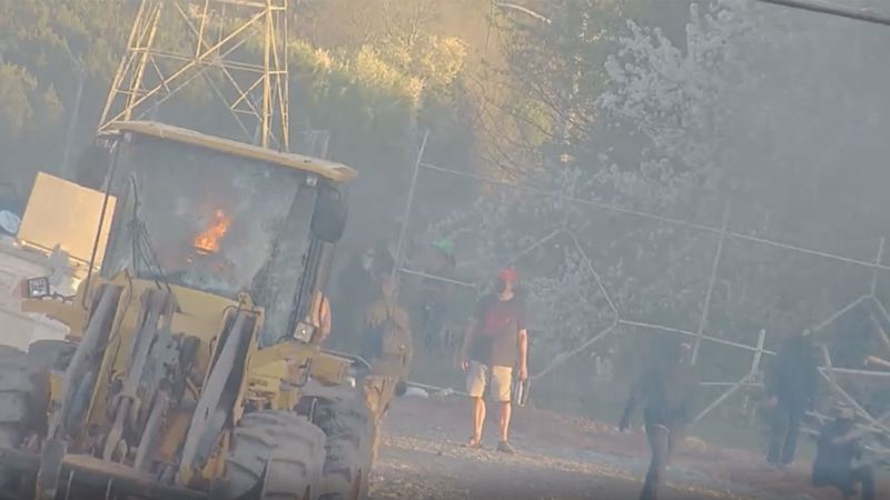 NextImg:Dozens detained after a construction vehicle was set ablaze and bricks were thrown at the proposed 'Cop City' police training site in Atlanta, authorities said | CNN