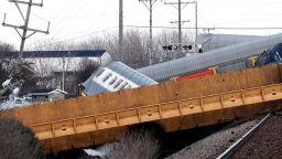 Multiple cars of a Norfolk Southern train lie toppled on one another after derailing at a train crossing with Ohio 41 in Clark County, Ohio, Saturday, March 4, 2023.