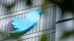 The Twitter logo is seen on a sign on the exterior of Twitter headquarters in San Francisco, California, on October 28, 2022. - After months of controversy, Elon Musk is now at the head of one of the most influential social networks on the planet, whose "tremendous potential" he has promised to unleash. 