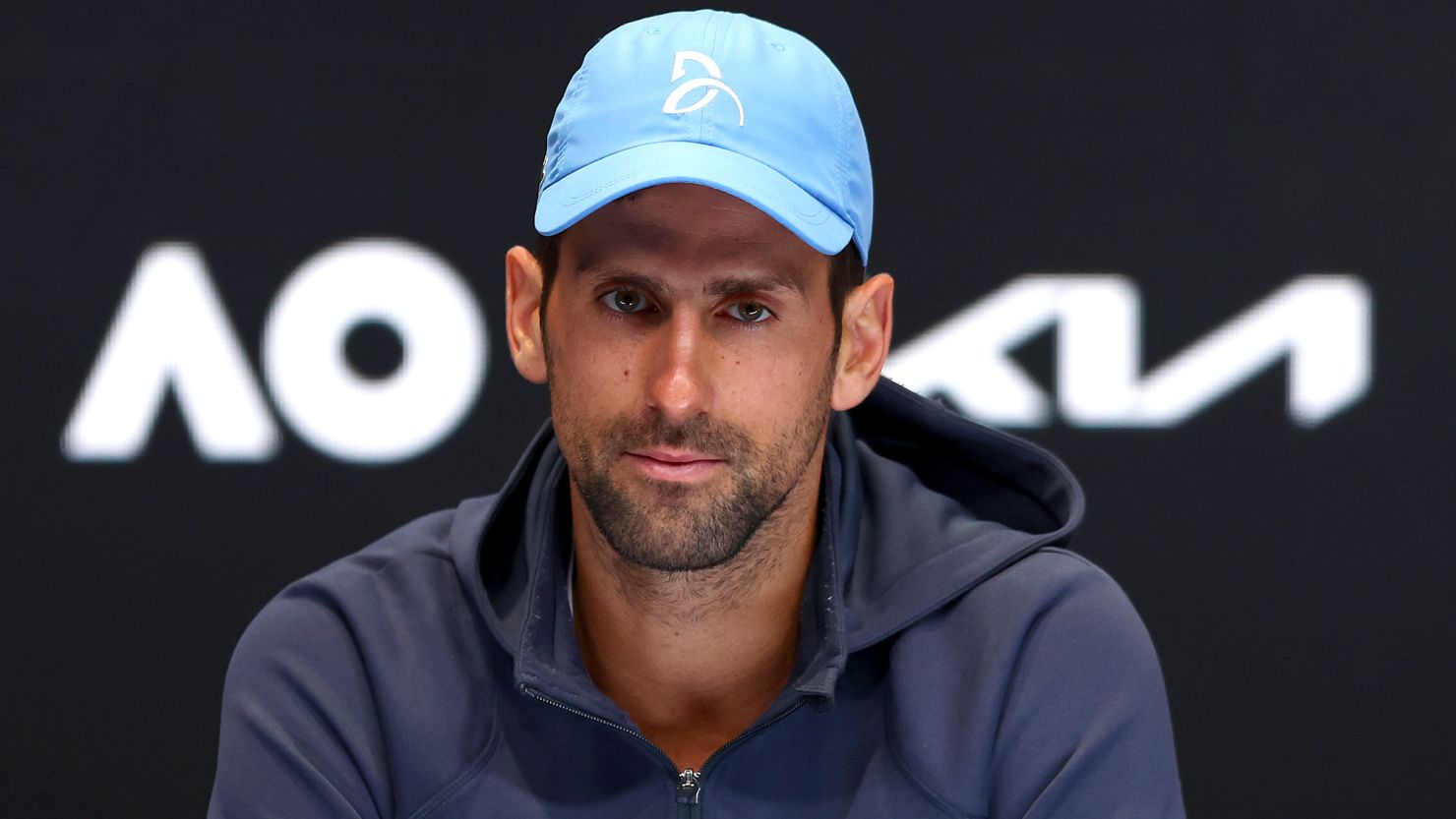 Djokovic talks to reporters at the Australian Open earlier this year. 