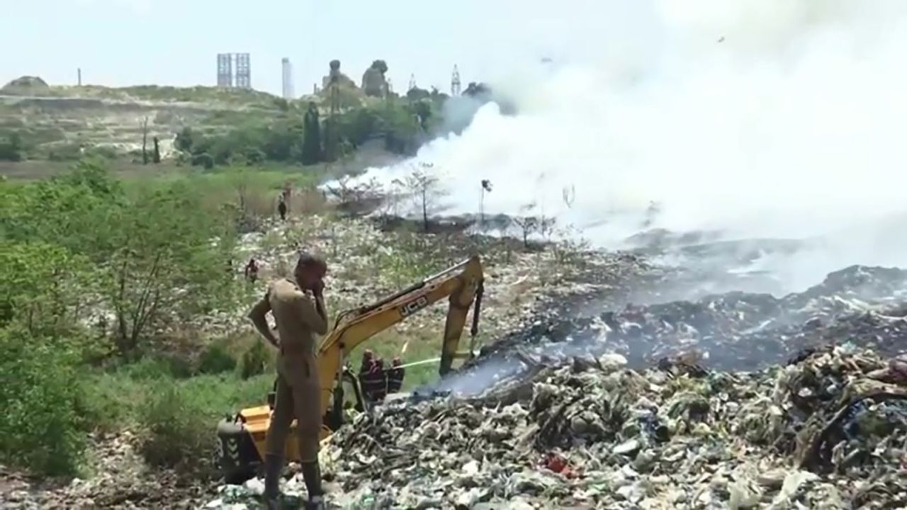 Firefighters work to put out a blaze at the Brahmapuram plant landfill in Kochi, India.