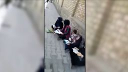 Afghan girls protest outside university as male students return to class.