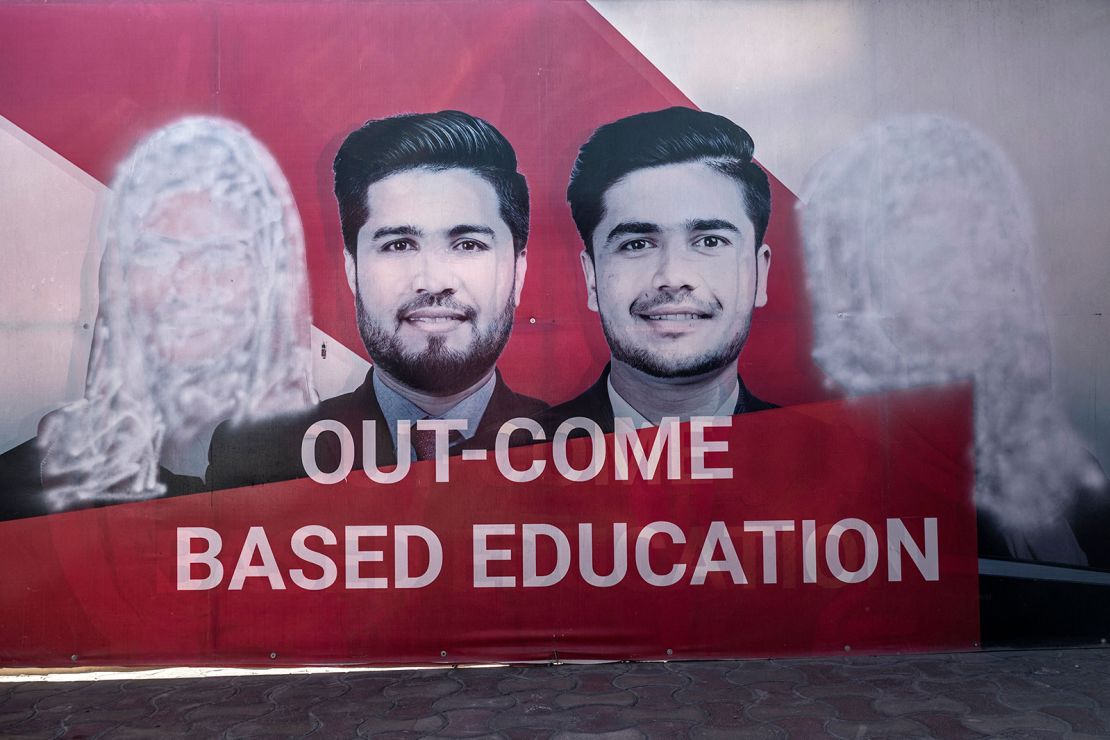 A banner with images of women defaced using spray paint inside a private university in Kabul, Afghanistan on March 6, 2023. 