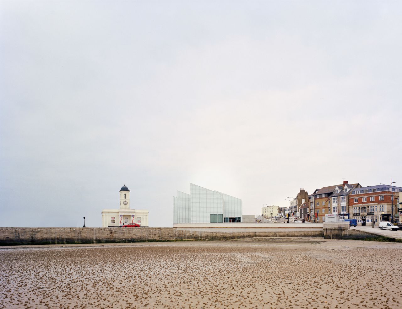 Located on the north coast of Kent, UK, the Turner Contemporary museum sees a concrete frame with acid-etched glass skin raised on a plinth.