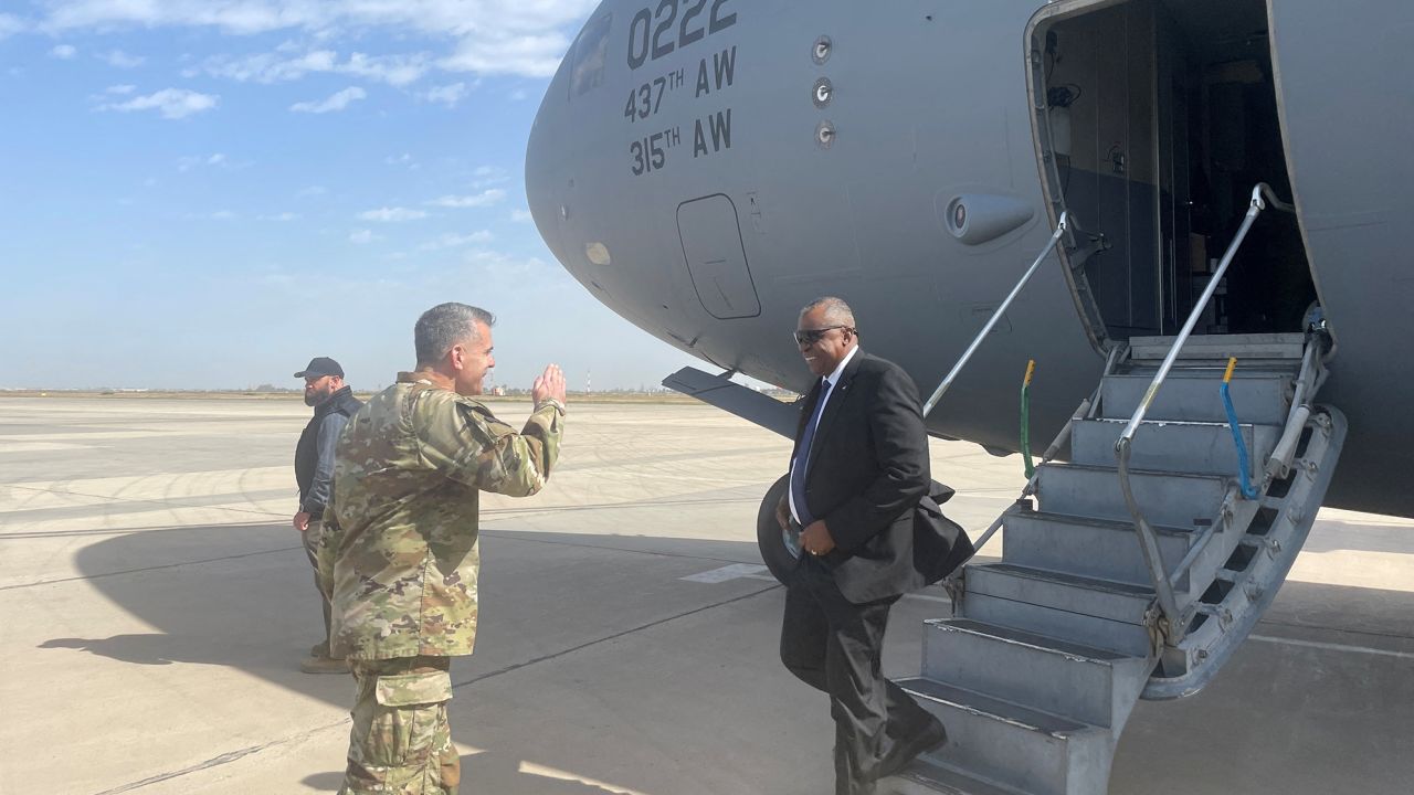 US Defense Secretary Lloyd Austin is greeted next to a plane by Major General Matthew McFarlane, during his unannounced trip to Baghdad, Iraq, March 7, 2023. 