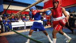 Cuban boxers fight during the first official women's boxing program in Cuba at the Giraldo Cordova boxing school in Havana, on December 17, 2022. - With a strong right jab to the face of his opponent, Elianni García Polledo (50kg), decided this Saturday the first official women's boxing match in Cuba, a day awaited for decades by the women of the island. (Photo by YAMIL LAGE / AFP) (Photo by YAMIL LAGE/AFP via Getty Images)