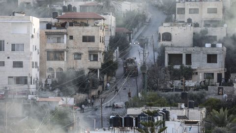 Palestinians clash with Israeli military forces during an Israeli operation in Jenin on Monday.