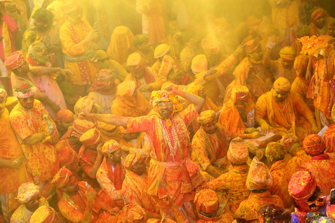 Devotees smear each other with colors in celebration of Holi on February 27, 2023.