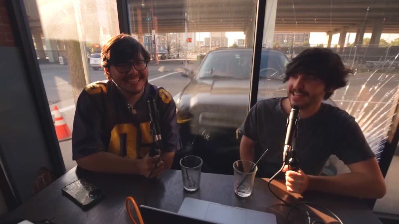 NextImg:Video shows scary moment car slams into cafe during podcast recording | CNN