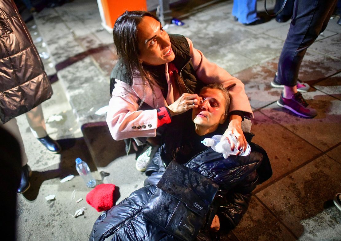 A woman affected by tear gas receives medical aid during a rally against the "foreign agents" law in Tbilisi, Georgia, March 7.