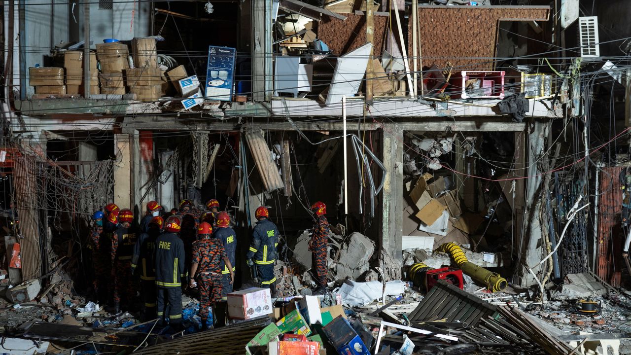 Firefighters and rescue workers search for survivors and bodies at the site of an explosion in Dhaka, Bangladesh, on March 7, 2023.