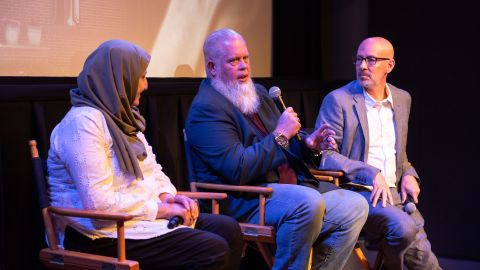 Bibi Bahrami, Richard "Mac" McKinney and filmmaker Joshua Seftel, from left, discuss Seftel's film, "Stranger at the Gate," at a screening.