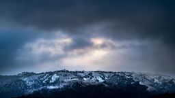 BIG SUR, CALIFORNIA - FEBRUARY 23, 2023: As the sun rises, threatening clouds hover above a rare accumulation of snow in the mountains of the Los Padres National Forest in Big Sur, California on Thursday February 23, 2023. More snow is expected. (Melina Mara/The Washington Post)                                                                                                                                                                                              