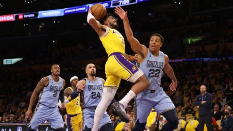Lakers forward Troy Brown Jr.  gets fouled by the Grizzlies' Desmond Bane while attempting a layup.