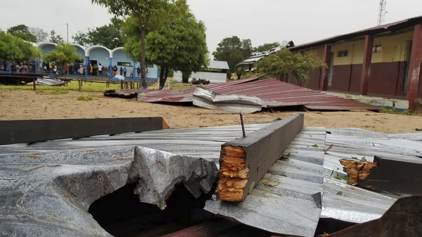 The damaged roof of a school lies in the playground in Vilanculos, Mozambique, on Feb. 24, 2023. The country is bracing for a rare second hit by long-lasting Tropical Cyclone Freddy.