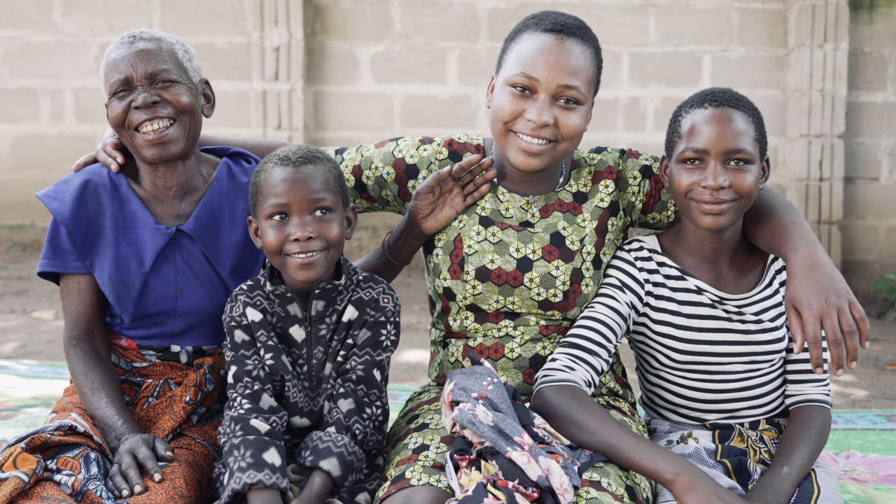 Mercy Esther (second from right) alongside her grandmother and siblings after being reunited.