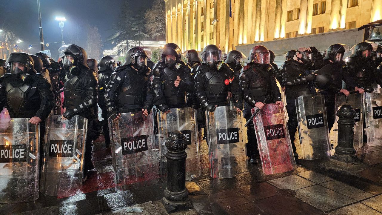Georgian riot police stand outside Georgia's Parliament in Tbilisi early on March 9, 2023.
