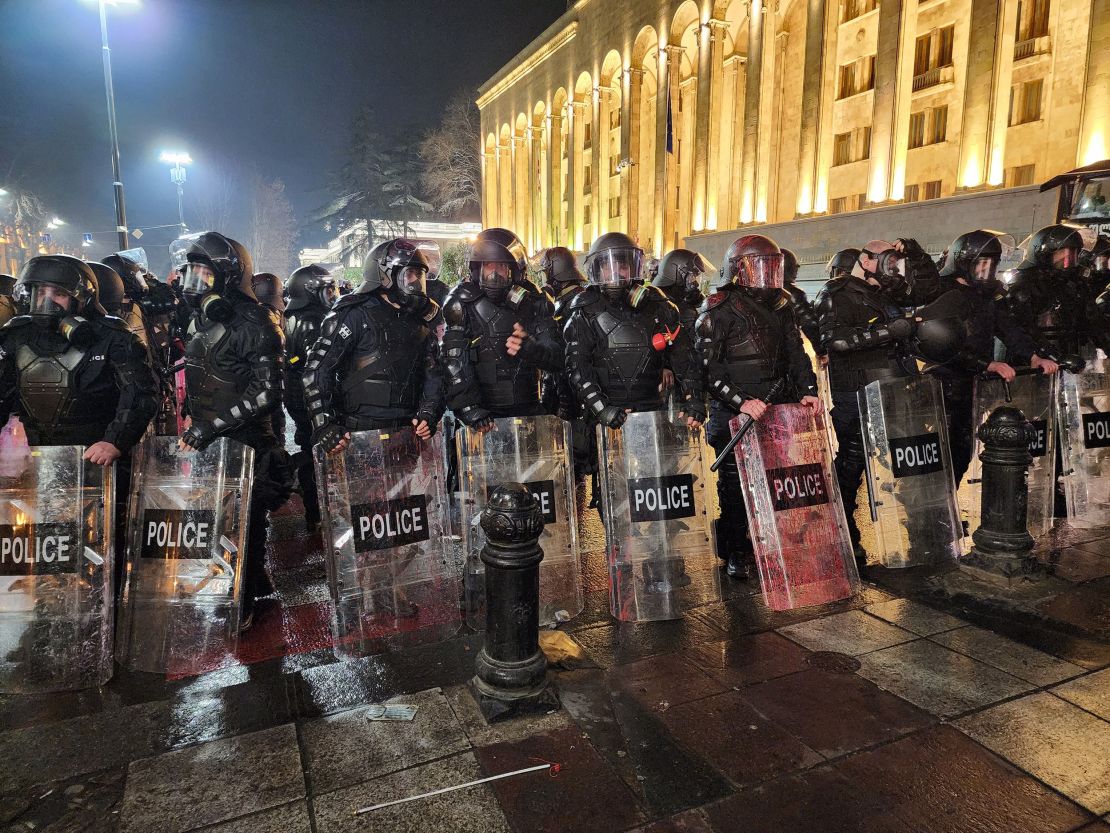 Georgian riot police stand outside Georgia's Parliament in Tbilisi early on March 9, 2023.