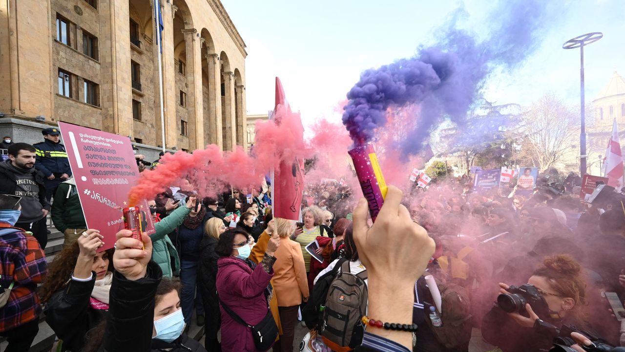 People take part in a demonstration outside Georgia's Parliament in Tbilisi on March 8, 2023 called by Georgian opposition and civil society groups against government plans to introduce controversial "foreign agent" legislation.