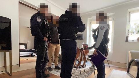 French police officers, here at the scene of the break-in, were quick to pursue the burglars of Lynn Ban's rented apartment. Lynn Ban, her husband Jett Kain and fellow "Bling Empire: New York" castmember Blake Abbie were visiting Paris for Fashion Week, according to their agent, Gia Khan. (CNN blurred portions of the image to protect officers' identity).