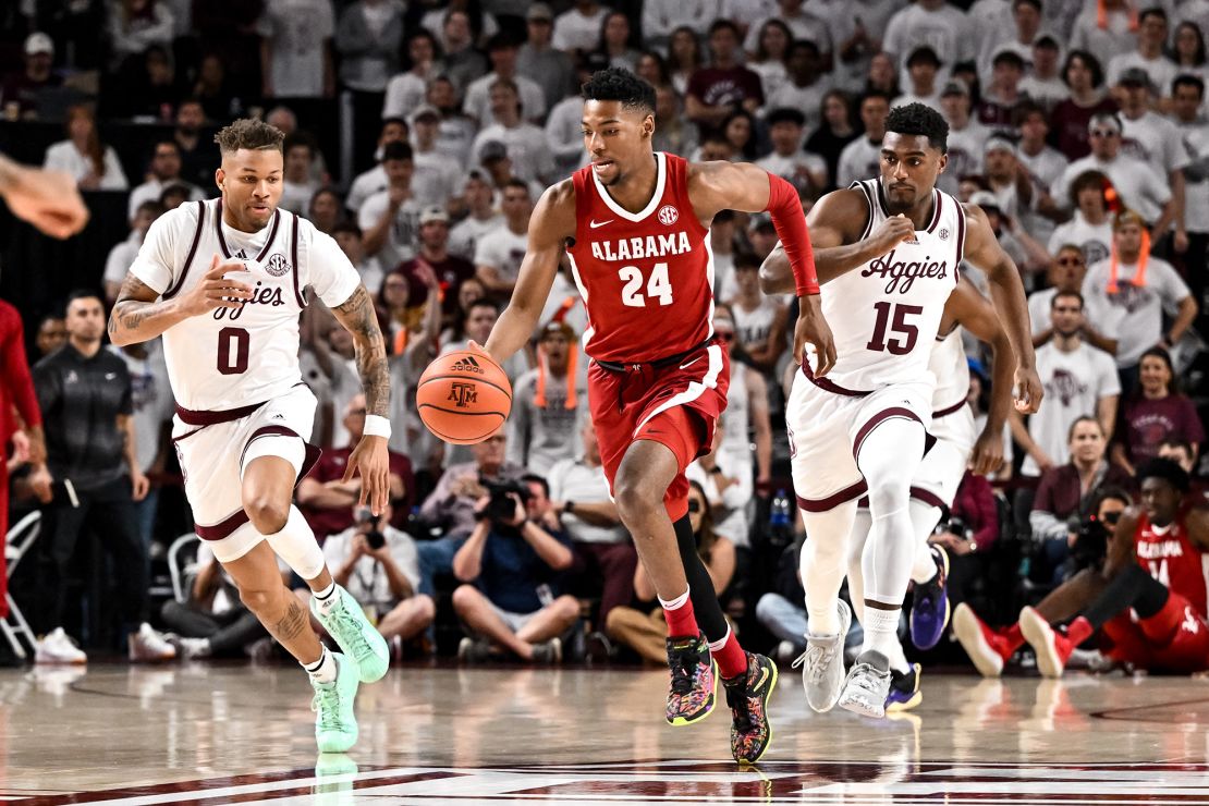 Miller dribbles the ball.