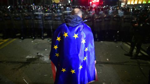 A demonstrator in Georgia, pictured on March 9, wears an EU flag during a protest against the proposed 