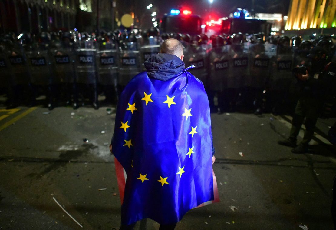 A demonstrator in Georgia, pictured on March 9, 2023, wears an EU flag during a protest against the proposed "foreign agents" bill.