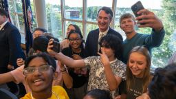 Virginia Gov. Glenn Youngkin takes photos with students after signing an executive order at Colonial Forge High School in Stafford, Virginia, on September 1, 2022.