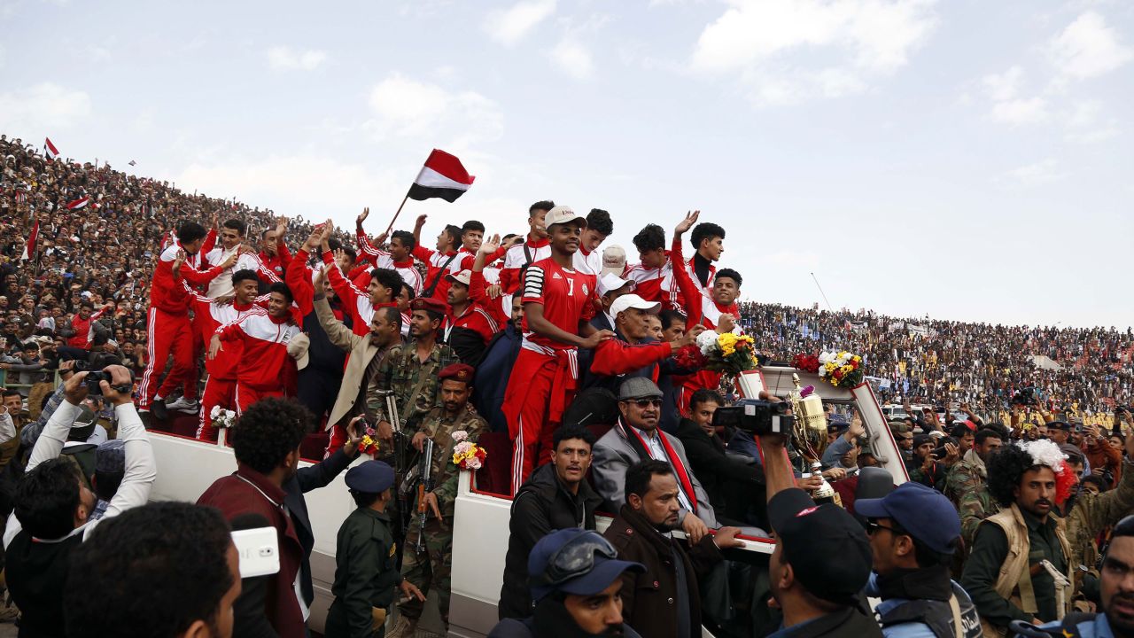 Yemenis celebrate with the national junior football team as they arrive in Sana'a.