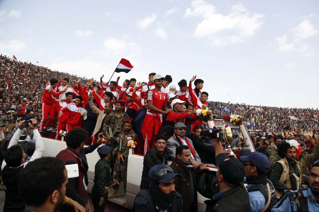  Yemenis celebrate with the national junior football team as they arrive in Sana'a.