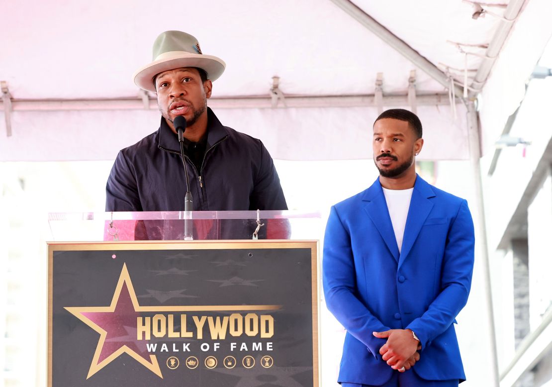 Jonathan Majors and Michael B. Jordan speak during the Hollywood Walk Of Fame Star Ceremony honoring Michael B. Jordan on March 1, 2023 in Hollywood, California.