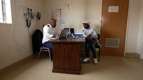 Julius Molepi receiving prescription for antiretroviral pills at Motebang Hospital in Lesotho.