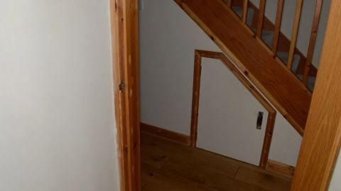 The small cupboard under the stairs where Carrick imprisoned some of his victims.