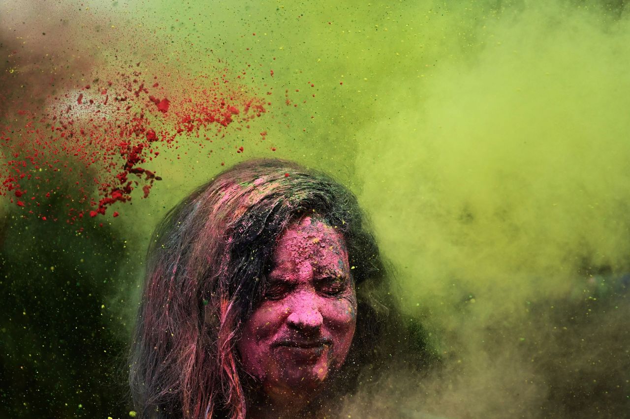 //www.cnn.com/2023/03/07/world/holi-2023-celebration-photos-cec/index.html" target="_blank">Holi reveler</a> is showered with colored powder during celebrations in Mumbai, India, on Tuesday, March 7.