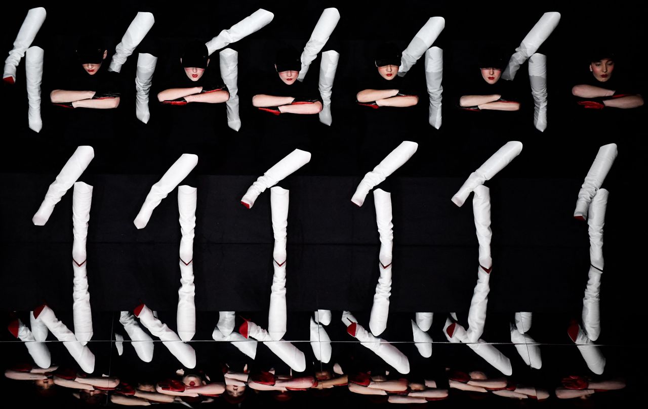 Dancers wearing Christian Louboutin shoes perform on the sidelines of Paris Fashion Week to celebrate the 30th anniversary of Louboutin's famous red sole on Thursday, March 2.