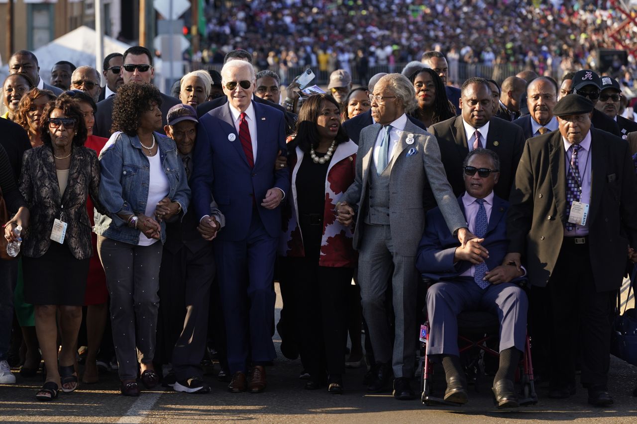 US President Joe Biden, center, prepares to walk across the Edmund Pettus Bridge in Selma, Alabama, on Sunday, March 5. US Rep. Terri Sewell, the Rev. Al Sharpton and the Rev. Jesse Jackson joined him to commemorate <a href="https://www.cnn.com/2023/03/05/politics/joe-biden-selma-bloody-sunday/index.html" target="_blank">the 58th anniversary of the "Bloody Sunday" march</a> that galvanized the civil rights movement.
